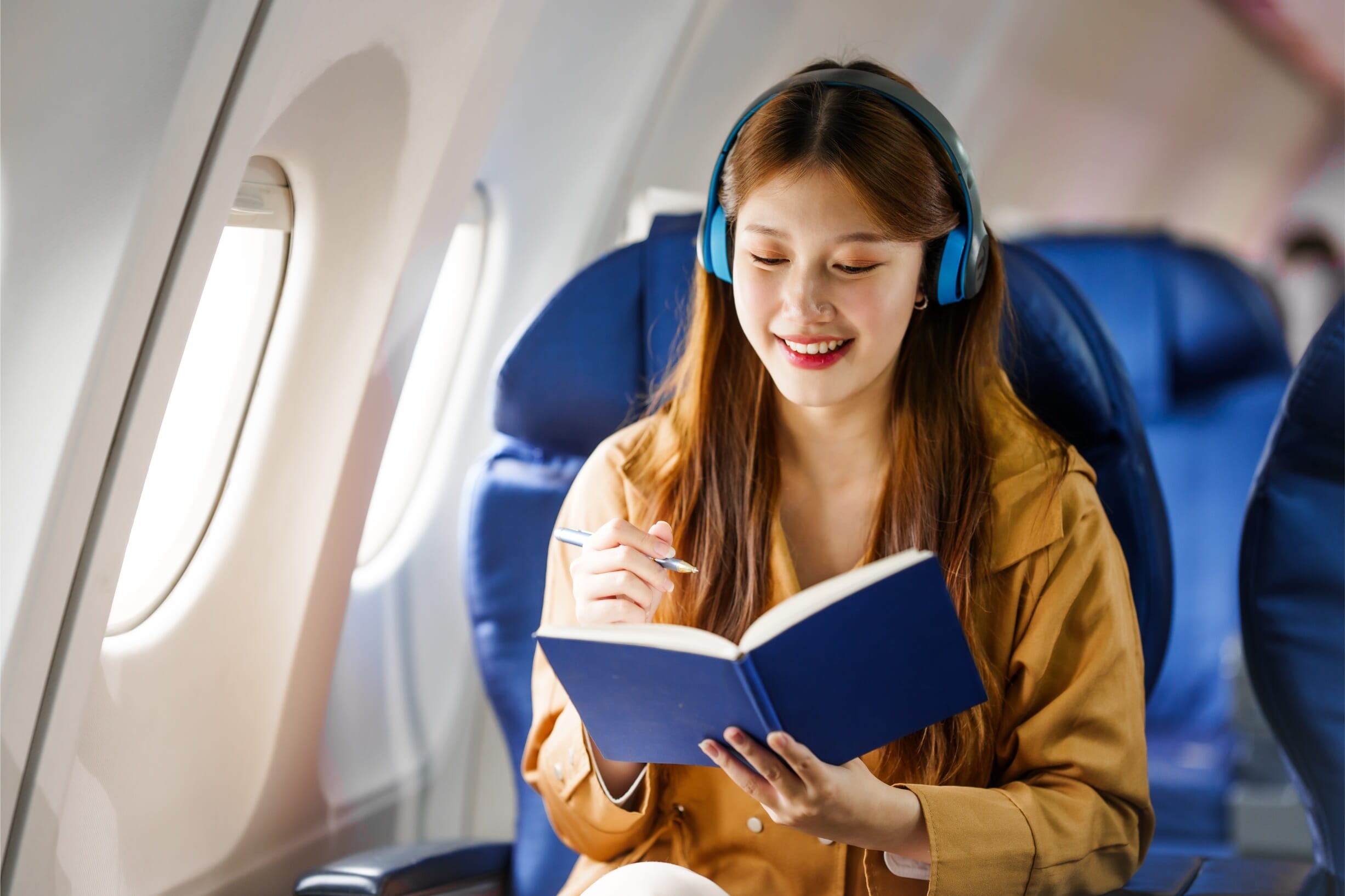 Girl taking a journey abroad on an aeroplane 