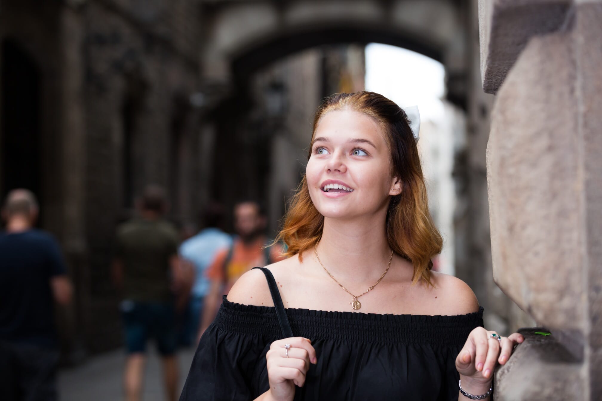 girl with red hair wandering the city